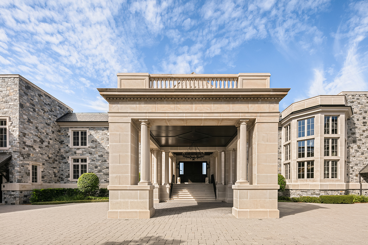 Front view of Derek Jeter’s Davis Islands Mansion. Entrance way of luxury stone and pavers under the large porte cochere.
