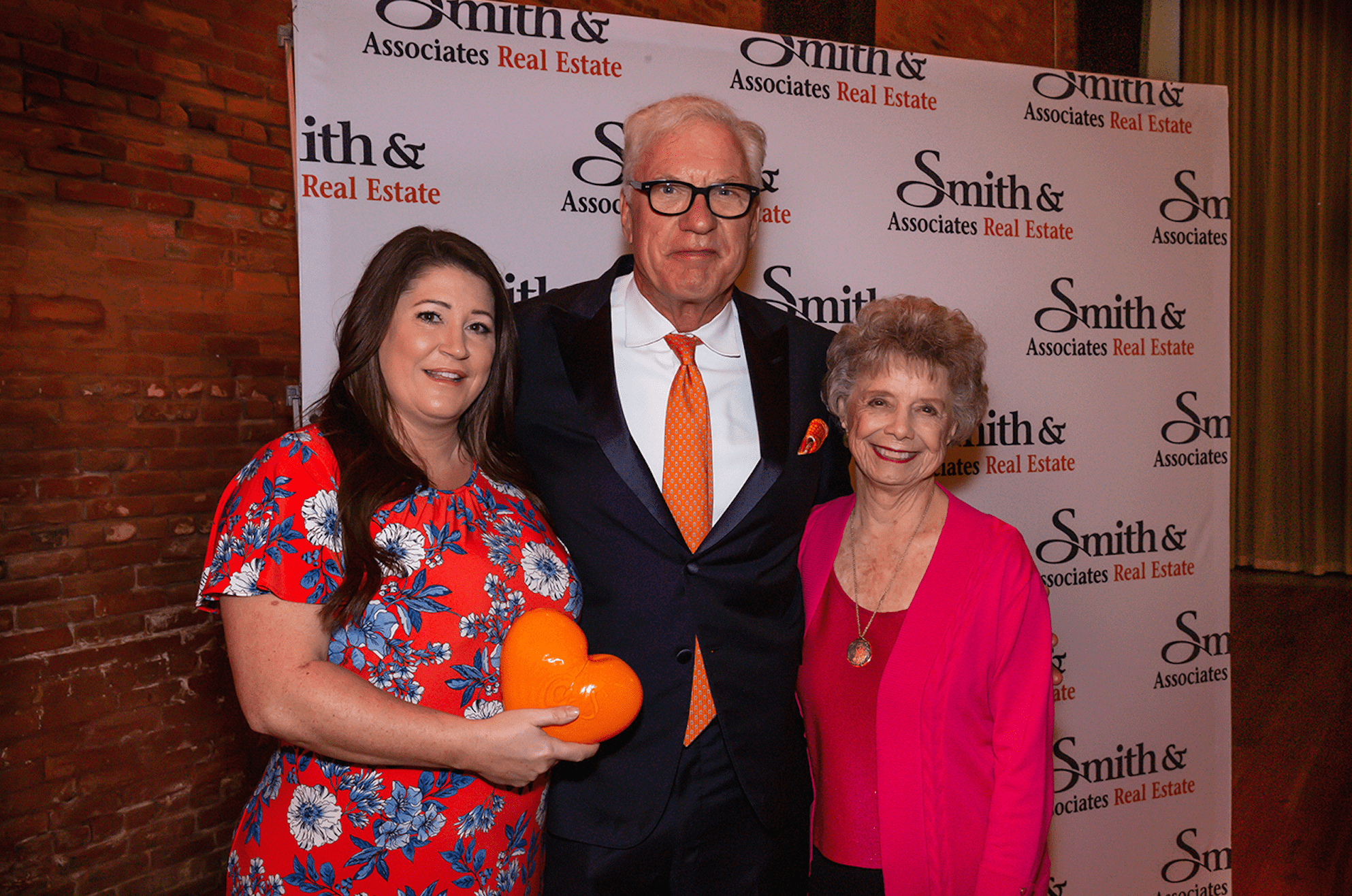 Becky Slocum (Award Recipient), Bob Glaser (President and CEO), and Mary Smith Conover (Founder) at Kickoff Celebration at Armature Works