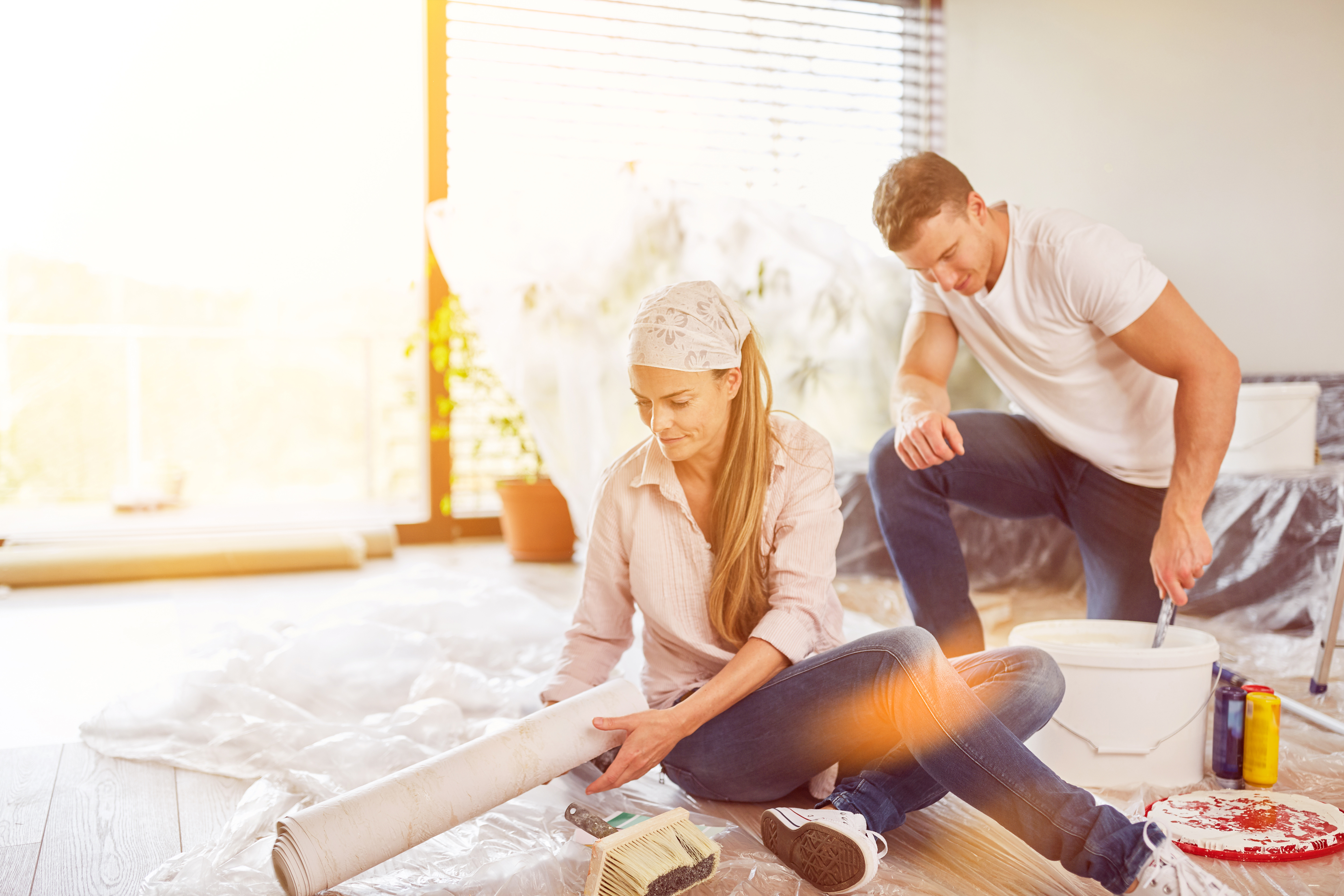 Couple sitting on floor making Home Improvements